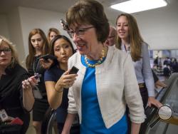 Sen. Susan Collins, R-Maine is surrounded by reporters as she heads to the Senate on Capitol Hill in Washington, Thursday, July 27, 2017, while the Republican majority in Congress remains stymied by their inability to fulfill their political promise to repeal and replace "Obamacare" because of opposition and wavering within the GOP ranks. (AP Photo/J. Scott Applewhite)