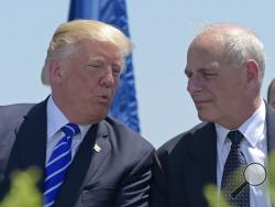 FILE - In this May 17, 2017, file photo, President Donald Trump talks with Homeland Security Secretary John Kelly during commencement exercises at the U.S. Coast Guard Academy in New London, Conn. Trump named Kelly as his new Chief of Staff on July 28, ousting Reince Priebus. (AP Photo/Susan Walsh)