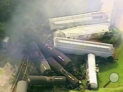 In this aerial image made from a video provided by WPXI, smoke rises in the air after dozens of cars of a freight train carrying hazardous materials derailed in Hyndman, Pa., Wednesday, Aug. 2, 2017. County officials ordered all residents of the small Pennsylvania town to evacuate after the derailment. (WPXI via AP)