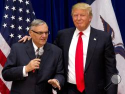 FILE - In this Jan. 26, 2016 file photo, then-Republican presidential candidate Donald Trump is joined by Joe Arpaio, the sheriff of metro Phoenix, at a campaign event in Marshalltown, Iowa. President Donald Trump has pardoned former sheriff Joe Arpaio following his conviction for intentionally disobeying a judge's order in an immigration case. The White House announced the move Friday night, Aug. 25, 2017, saying the 85-year-old ex-sheriff of Arizona's Maricopa County was a "worthy candidate" for a preside