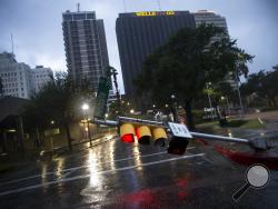 A damaged stop light blocks a street as Hurricane Harvey makes landfall in Corpus Christi, Texas, on Friday, Aug. 25, 2017. Hurricane Harvey smashed into Texas late Friday, lashing a wide swath of the Gulf Coast with strong winds and torrential rain from the fiercest hurricane to hit the U.S. in more than a decade. (Nick Wagner/Austin American-Statesman via AP)