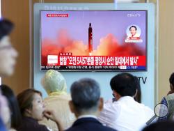 People watch a TV screen showing a file footage of North Korea's missile launch, at the Seoul Railway Station in Seoul, South Korea, Tuesday, Aug. 29, 2017. North Korea fired a ballistic missile from its capital Pyongyang that flew over Japan before plunging into the northern Pacific Ocean, officials said Tuesday, an especially aggressive test-flight that will rattle an already anxious region. The signs read " South Korea's Joint Chiefs of Staff said North Korea fired a ballistic from its capital Pyongyang 