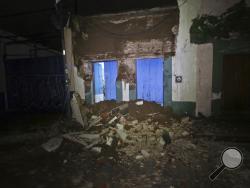 Debris from a collapsed wall sits in Oaxaca, Mexico, after an earthquake early Friday, Sept. 8, 2017. A massive 8-magnitude earthquake hit off the coast of southern Mexico late Thursday night, causing buildings to sway violently and people to flee into the street in panic as far away as the capital city.(AP Photo/Luis Alberto Cruz)