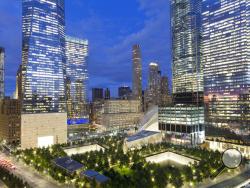 In this Friday, Sept. 8, 2017 photo, the National September 11 Memorial and Museum, bottom, is surrounded by high-rise towers in New York. The new towers are: WTC 1, second from left, WTC 7, third from left, WTC 3, second from right, and WTC 4, right. Monday will mark the sixteenth anniversary of the terrorist attacks. (AP Photo/Mark Lennihan)