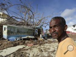 Juan Antonio Higuey shows his destroyed home at Cold Bay community after the passage of Hurricane Irma, in St. Martin, Monday, September 11, 2017. Irma cut a path of devastation across the northern Caribbean, leaving thousands homeless after destroying buildings and uprooting trees. (AP Photo/Carlos Giusti)