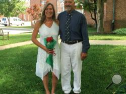 In this July 7, 2017 photo provided by Diane Tippett, Diane Tippett poses with her husband Robbie after their wedding ceremony, on the lawn of the courthouse in Leonardtown, Maryland. Last October Lucey came to Georgetown Lombardi Comprehensive Cancer Center with a salivary gland cancer that had spread to her liver and lungs. Lucey received Opdivo, one of a wave of new drugs that help the immune system see and fight cancer. "I don't feel any different than you do. I'm not tired, I've got all my hair," she s