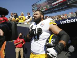 Pittsburgh Steelers offensive tackle and former Army Ranger Alejandro Villanueva (78) stands outside the tunnel alone during the national anthem before an NFL football game against the Chicago Bears, Sunday, Sept. 24, 2017, in Chicago. (AP Photo/Nam Y. Huh)