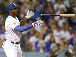 Los Angeles Dodgers' Yasiel Puig celebrates after a single against the Arizona Diamondbacks during the fourth inning of Game 2 of baseball's National League Division Series in Los Angeles, Saturday, Oct. 7, 2017. (AP Photo/Mark J. Terrill)