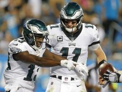 Philadelphia Eagles' Nelson Agholor (13) celebrates his touchdown catch against the Carolina Panthers with quarterback Carson Wentz (11) in the second half of an NFL football game in Charlotte, N.C., Thursday, Oct. 12, 2017. (AP Photo/Bob Leverone)