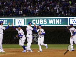Chicago Cubs' Kris Bryant (17), Jon Jay (30), Anthony Rizzo (44), Ian Happ (8) and Jason Heyward (22) celebrate after Game 4 of baseball's National League Championship Series against the Los Angeles Dodgers, Wednesday, Oct. 18, 2017, in Chicago. The Cubs won 3-2. (AP Photo/Matt Slocum)