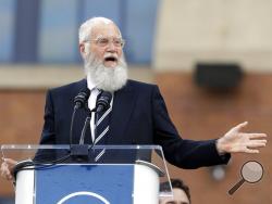 FILE - In this Saturday, Oct. 7, 2017, file photo, David Letterman speaks during the unveiling of a Peyton Manning statue outside of Lucas Oil Stadium, in Indianapolis. Letterman is being honored with the Mark Twain Prize for American Humor. He received the lifetime achievement award Sunday, Oct. 22, 2017, at Washington’s Kennedy Center. (AP Photo/Darron Cummings, File)