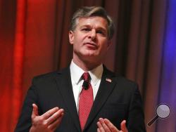 FBI Director Christopher Wray speaks at the International Association of Chiefs of Police annual conference Sunday, Oct. 22, 2017, in Philadelphia. Wray said federal agents haven’t been able to retrieve data from more than half of the mobile devices they’ve tried to access in a year. (AP Photo/Michael Balsamo)