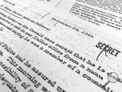 Part of a file, dated Nov. 24, 1963, quoting FBI director J. Edgar Hoover as he talks about the death of Lee Harvey Oswald, released for the first time on Thursday, Oct. 26, 2017, is photographed in Washington. The public is getting a look at thousands of secret government files related to President John F. Kennedy's assassination, but hundreds of other documents will remain under wraps for now. The government was required by Thursday to release the final batch of files related to Kennedy's assassination in
