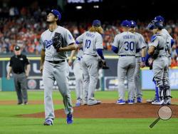 Los Angeles Dodgers starting pitcher Yu Darvish, of Japan, leaves the game against the Houston Astros during the second inning of Game 3 of baseball's World Series Friday, Oct. 27, 2017, in Houston. (AP Photo/Matt Slocum)
