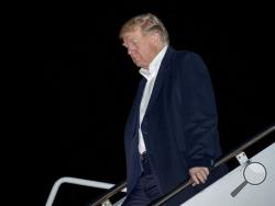  President Donald Trump arrives at Andrews Air Force Base, Md., Tuesday, Nov. 14, 2017, to board Marine One for a short trip to the White House. Trump returns from a five country trip through Asia traveling to Japan, South Korea, China, Vietnam and the Philippines. (AP Photo/Andrew Harnik)