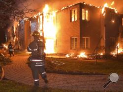 Firefighters battle a blaze at the Barclay Friends Senior Living Community in West Chester, Pa., Thursday, Nov. 16, 2017. Chester County emergency officials say at least 20 people have been taken to area hospitals for treatment. The extent of their injuries was not immediately known. (Pete Bannan/Daily Local News via AP)