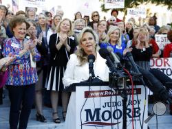 Kayla Moore, wife of former Alabama Chief Justice and U.S. Senate candidate Roy Moore, speaks at a press conference, Friday, Nov. 17, 2017, in Montgomery, Ala. Moore spoke out in defense of her husband, saying they have been married for over 32 years and the Army veteran has always been an officer and a gentleman. (AP Photo/Brynn Anderson)