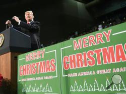 President Donald Trump takes to the stage at a campaign-style rally at the Pensacola Bay Center, in Pensacola, Fla., Friday, Dec. 8, 2017. (AP Photo/Susan Walsh)