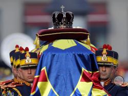  Honor guard soldiers carry the coffin of the late Romanian King Michael during the funeral ceremony outside the former royal palace in Bucharest, Romania, Saturday, Dec.16, 2017. Thousands waited in line to pay their respects to Former King Michael, who ruled Romania during WWII, and died on Dec. 5, 2017, aged 96, in Switzerland. (AP Photo/Vadim Ghirda)