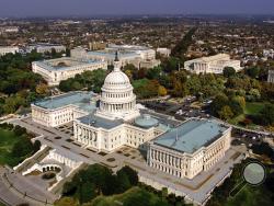 FILE - In this Oct. 24, 2001, file photo, the United States Capitol in Washington, D.C. is shown in an aerial view. The GOP-led Congress is hoping to approve a must-pass spending bill as the clock ticks toward potential government shutdown this weekend. (AP Photo/J. Scott Applewhite, File)
