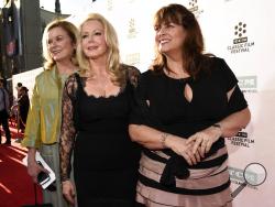 FILE - In this March 26, 2015, file photo, Heather Menzies-Urich, from left, Kym Karath and Debbie Turner, cast members in the classic film "The Sound of Music," pose together before a 50th anniversary screening of the film at the opening night gala of the 2015 TCM Classic Film Festival in Los Angeles. Menzies-Urich, who played one of the singing von Trapp children in the 1965 hit film, has died. She was 68. Menzies-Urich’s son, actor Ryan Urich, told Variety that his mother died late Sunday, Dec. 24, 2017,
