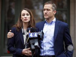FILE - In this Dec. 6, 2016, file photo, Missouri Gov.-elect Eric Greitens and his wife Sheena speak to the media in St. Louis after she had been robbed at gunpoint the day before. Missouri Gov. Eric Greitens appears to be bracing for a fight to preserve his political life after admitting to an extramarital affair but denying anything more. Greitens met Thursday, Jan. 11, 2018, with Cabinet members and placed calls to rally support while his attorney issued firm denials to a smattering of allegations relate