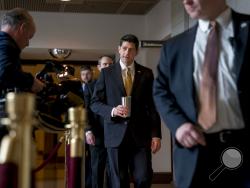 House Speaker Paul Ryan of Wis., center, walks to the Capitol Building from the Capitol Visitor's Center, Thursday, Jan. 18, 2018, in Washington. (AP Photo/Andrew Harnik)