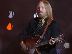 FILE - In this Sunday, Feb. 3, 2008 file photo, Tom Petty, of Tom Petty and the Heartbreakers, performs during halftime of the Super Bowl XLII football game between the New York Giants and the New England Patriots in Glendale, Ariz. Tom Petty's family says his death last year was due to an accidental drug overdose. His wife and daughter released the results of Petty's autopsy via a statement on his Facebook page Friday night, Jan. 19, 2018. (AP Photo/David J. Phillip, File)