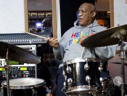 Bill Cosby plays the drums at the LaRose Jazz Club in Philadelphia on Monday, Jan. 22, 2018. It was his first public performance since his last tour ended amid protests in May 2015. Cosby has denied allegations from about 60 women that he drugged and molested them over five decades. He faces an April retrial in the only case to lead to criminal charges. (AP Photo/Michael R. Sisak)