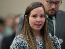 In this Jan. 23, 2018, photo, Brianne Randall-Gay gives her victim statement during Larry Nassar's sentencing at the Ingham County Circuit Court in Lansing, Mich., Tuesday, Jan. 23, 2018. As a teenager Randall-Gay complained to the Meridian Township police department in 2004 that Nassar had molested her during treatment for an abnormal spine, an official said Wednesday, Jan. 31. (Neil Blake/The Grand Rapids Press via AP)