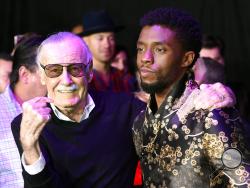 FILE - In this Monday, Jan. 29, 2018 file photo, comic book legend Stan Lee, left, creator of the "Black Panther" superhero, poses with Chadwick Boseman, star of the new "Black Panther" film, at the premiere at The Dolby Theatre in Los Angeles. Lee, the master and creator behind Marvel’s biggest superheroes, died at age 95 Monday, Nov. 12, 2018 at a Los Angeles hospital. The works and ideas of Lee and the artists behind T’Challa, the Black Panther; Luke Cage, Hero for Hire; and Professor Xavier’s band of me