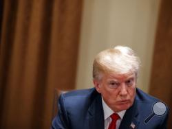 In this Feb. 6, 2018, photo, President Donald Trump listens during a meeting with law enforcement officials on the MS-13 street gang and border security, in the Cabinet Room of the White House in Washington. Trump is continuing his habit of painting immigrants as criminals, highlighting gang connections, calling family reunification a national security threat and bemoaning the death of a pro football player involved in a car accident with a man living in the country illegally. (AP Photo/Evan Vucci)