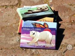 This undated photo provided by the Center for Biological Diversity in Tucson, Ariz., shows condom packages designed by Lori Lieber from the center's "Endangered Species Condoms" series, featuring rhyming maxims and Shawn DiCriscio's illustrations of animal species threatened by population growth. As part of the center's "Pillow Talk" program, hundreds of the condoms will be distributed for free during evening Valentine's Day events for adults on Friday, Feb. 9, 2018, at the Carnegie Science Center in Pittsb