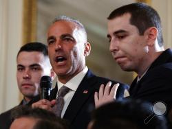 Andrew Pollack, father of slain Marjory Stoneman Douglas High School student Meadow Jade Pollack, joined by his sons, speaks during a listening session with President Donald Trump, high school students, teachers and others in the State Dining Room of the White House in Washington, Wednesday, Feb. 21, 2018. (AP Photo/Carolyn Kaster)