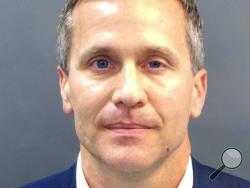  A booking photo provided by the St. Louis Metropolitan Police Department shows Missouri Gov. Eric Greitens on Thursday, Feb. 22, 2018. A St. Louis grand jury has indicted Greitens on a felony invasion of privacy charge for allegedly taking a compromising photo of a woman with whom he had an affair in 2015, the city circuit attorney's office said Thursday. Greitens' attorney issued a scathing statement challenging the indictment. (St. Louis Metropolitan Police Department/St. Louis Post-Dispatch via AP)