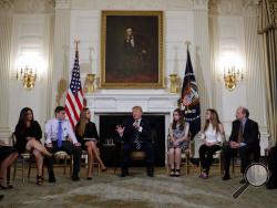In this Feb. 21, 2018, photo, President Donald Trump hosts a listening session with high school students, teachers and parents in the State Dining Room of the White House in Washington. Trump could face a backlash from gun rights advocates who fear he’s strayed from his pledge to be a champion for the Second Amendment by voicing support for gun control measures in the wake of the deadly school shooting in Florida. (AP Photo/Carolyn Kaster, File)