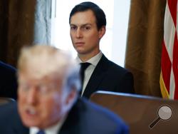 FILE - In this Nov. 1, 2017, file photo, White House senior adviser Jared Kushner listens as President Donald Trump speaks during a cabinet meeting at the White House in Washington. Politico is reporting that the security clearance of White House senior adviser and Trump son-in-law Jared Kushner has been downgraded. (AP Photo/Evan Vucci, File)