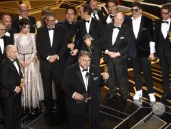 Guillermo del Toro and the cast and crew of "The Shape of Water" accept the award for best picture at the Oscars on Sunday, March 4, 2018, at the Dolby Theatre in Los Angeles. (Photo by Chris Pizzello/Invision/AP)