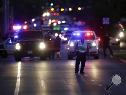 Emergency vehicles stage near the site of another explosion, Tuesday, March 20, 2018, in Austin, Texas. (AP Photo/Eric Gay)