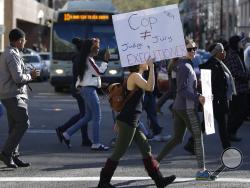 Protestors block traffic in a demonstration, Thursday, March 22, 2018, over the shooting death of Stephon Alonzo Clark, Sunday, by two Sacramento Police officers. (AP Photo/Rich Pedroncelli)