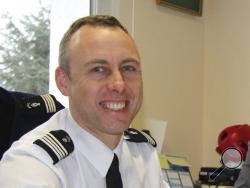In this image dated March 2013 and provided by regional newspaper Ouest France, Arnaud Beltrame poses for a photo in Avranches, western France. The officer who offered to be swapped for a female hostage was identified as Col. Arnaud Beltrame. He managed to surreptitiously leave his phone on so that police outside could hear what was going on inside the supermarket — and crucially, decide when to storm it. (Ouest France via AP)