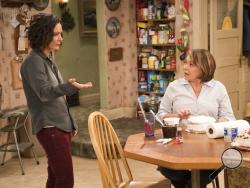 This image released by ABC shows Sara Gilbert, left, and Roseanne Barr in a scene from "Roseanne." The unprecedented sudden cancellation of TV’s top comedy has left a wave of unemployment and uncertainty in its wake. Barr’s racist tweet and the almost immediate axing of her show put hundreds of people out of work. (Greg Gayne/ABC via AP)