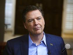 In this image released by ABC News, former FBI director James Comey appears at an interview with George Stephanopoulos that will air during a primetime "20/20" special on Sunday, April 15, 2018 on the ABC Television Network. Comey's book, "A Higher Loyalty: Truth, Lies, and Leadership," will be released on Tuesday. (Ralph Alswang/ABC via AP)