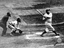 FILE - In this undated file photo, New York Yankees' Babe Ruth hits a home-run. As part of its collection of Babe Ruth items, the Baseball Hall of Fame says it has the bat the slugger used to hit his then-record 60th home run in 1927. (AP Photo/File)