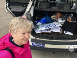 In this April 14, 2018, photo, Deb Patterson prepares to canvass in Independence, Ore.. hoping to win the Oregon May 15 primary and unseat four-term Republican Sen. Jackie Winters in November. A win could propel Democrats into a "supermajority" in the Oregon Legislature, with the ability to increase state revenue without Republican support. (AP Photo/Andrew Selsky)