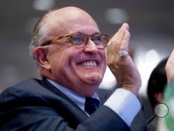 Rudy Giuliani, an attorney for President Donald Trump, applauds at the Iran Freedom Convention for Human Rights and democracy at the Grand Hyatt, Saturday, May 5, 2018, in Washington. (AP Photo/Andrew Harnik)