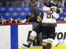 Vegas Golden Knights' Erik Haula (56) and Jonathan Marchessault (81) celebrate after defeating the Winnipeg Jets during NHL Western Conference Finals, game 5, in Winnipeg, Sunday, May 20, 2018. (Trevor Hagan/The Canadian Press via AP)