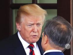 President Donald Trump talks to visiting South Korean President Moon Jae-in as he departs the White House in Washington, Tuesday, May 22, 2018. (AP Photo/Manuel Balce Ceneta)