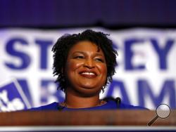 Democratic candidate for Georgia Governor Stacey Abrams smiles as she speaks during an election-night watch party Tuesday, May 22, 2018, in Atlanta. (AP Photo/John Bazemore)