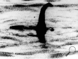 FILE -This is an undated file photo of a shadowy shape that some people say is a photo of the Loch Ness monster in Scotland. For hundreds of years, visitors to Scotland's Loch Ness have described seeing a monster that some believe lives in the depths. Now the legend of "Nessie" may have no place to hide. Researchers will travel there next month to take samples of the murky waters and use DNA tests to determine what species live there. (AP Photo, File)